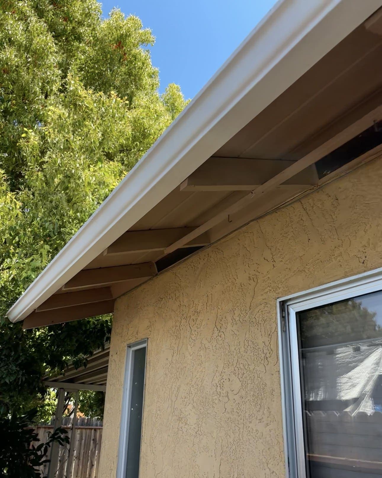 Bright white gutter and fascia after professional cleaning